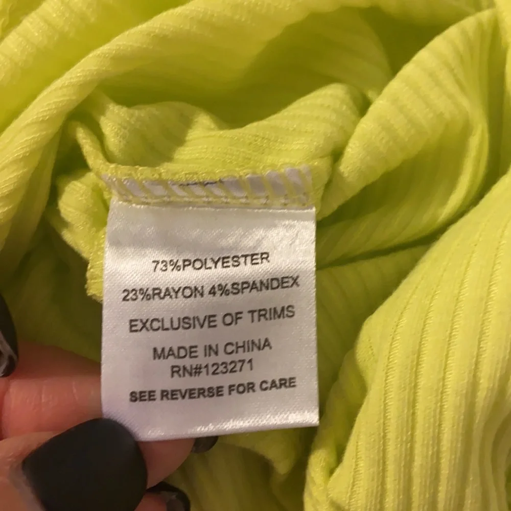 Neon yellow long sleeve sexy body suit. Size small. New with tags